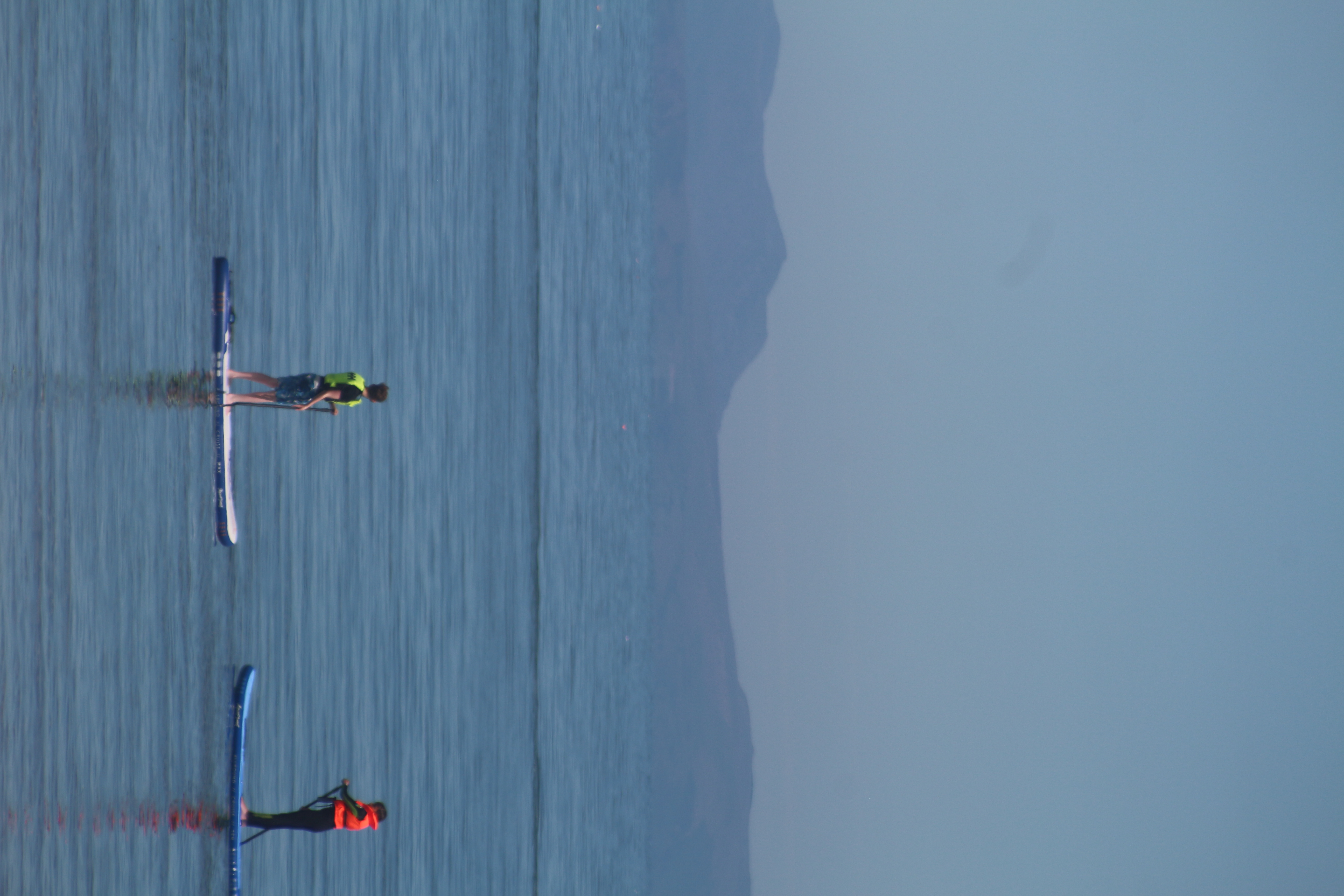 Two people on separate kayaks